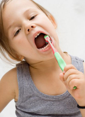Child receiving dental hygiene care